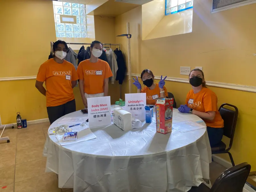 Penn KDSAP volunteers stand together at a screening station