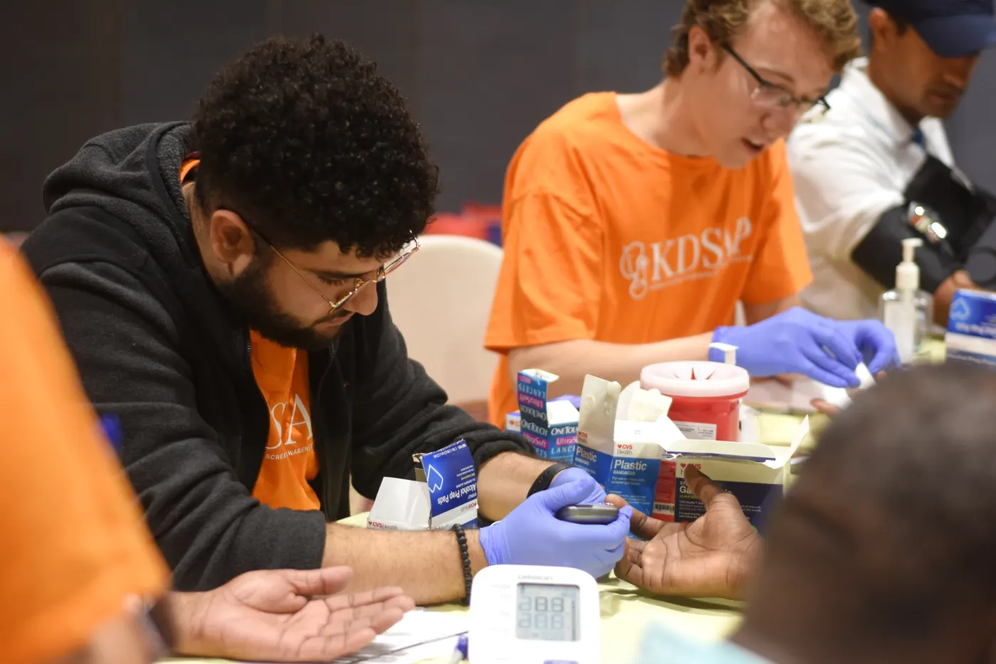 A Penn KDSAP volunteer assisting at a kidney health screening
